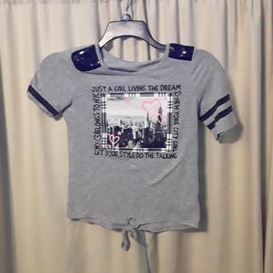 A gray Justice shirt